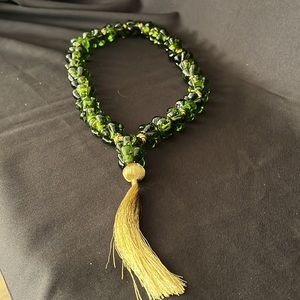 Decorative green glass beads with gold trim